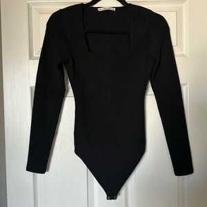 Black bodysuit. Ribbed material